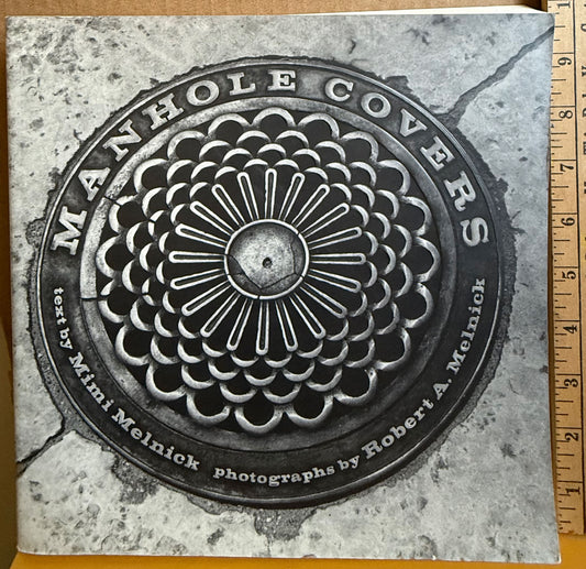 Melnick, Robert A., Manhole Covers, with photographs by Robert A. Melnick.
